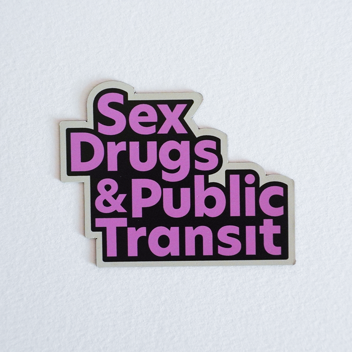 A magnet with a design that has the words "Sex Drugs and Public Transit" in a pink, black, and cream motif.