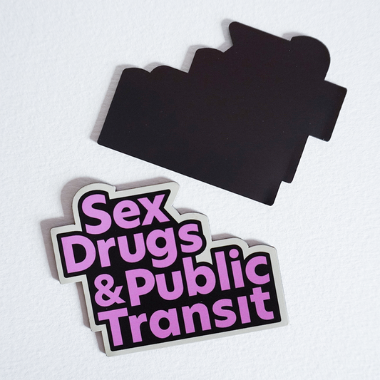 Two magnets with one showing the front and the other showing the back. The front facing magnet has a design with the words "Sex Drugs and Public Transit" in a pink, black, and cream motif. The back facing magnet shows a completely magnetized back.